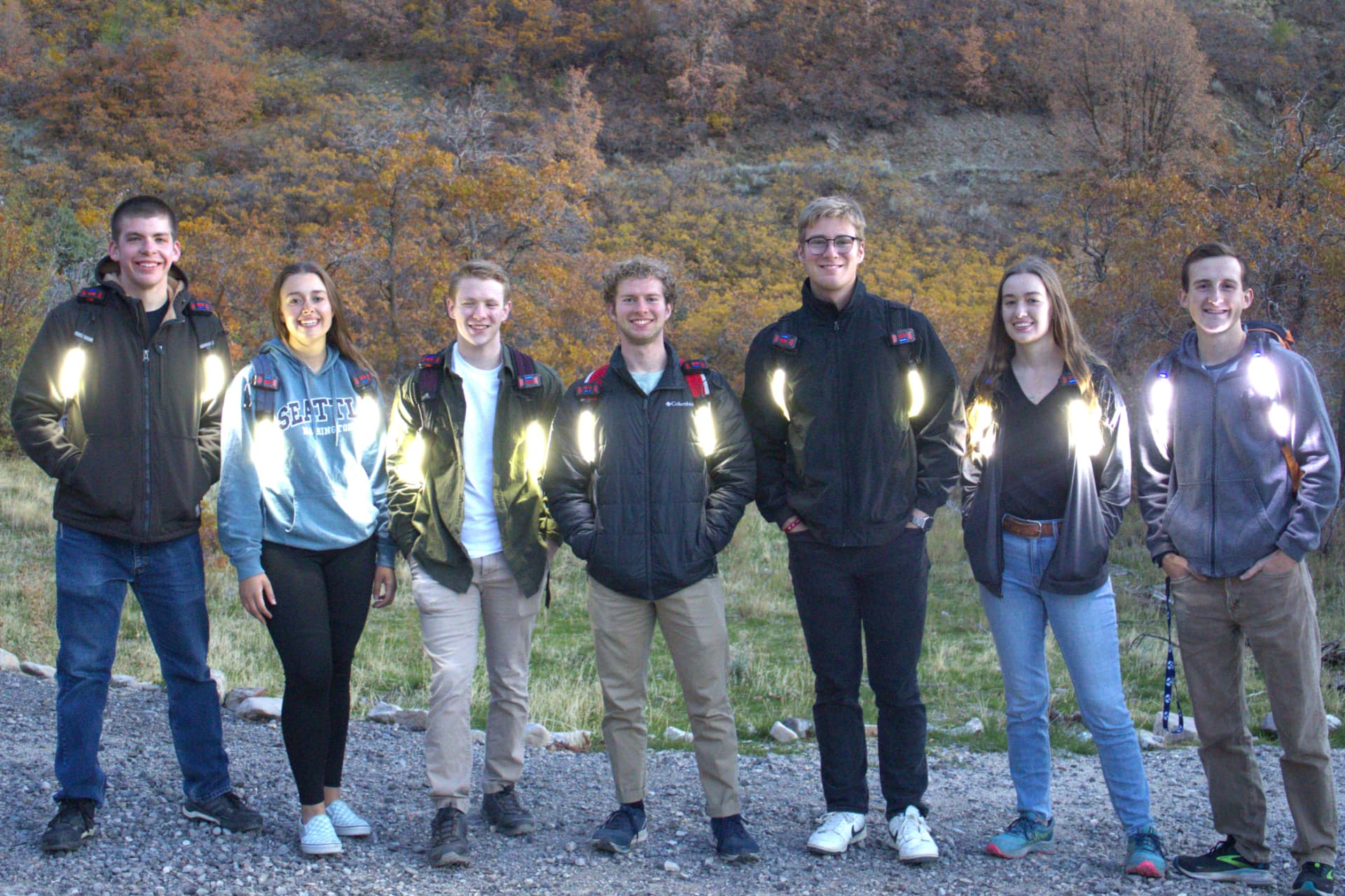 Team wearing StrapLights® on a night hike with friends