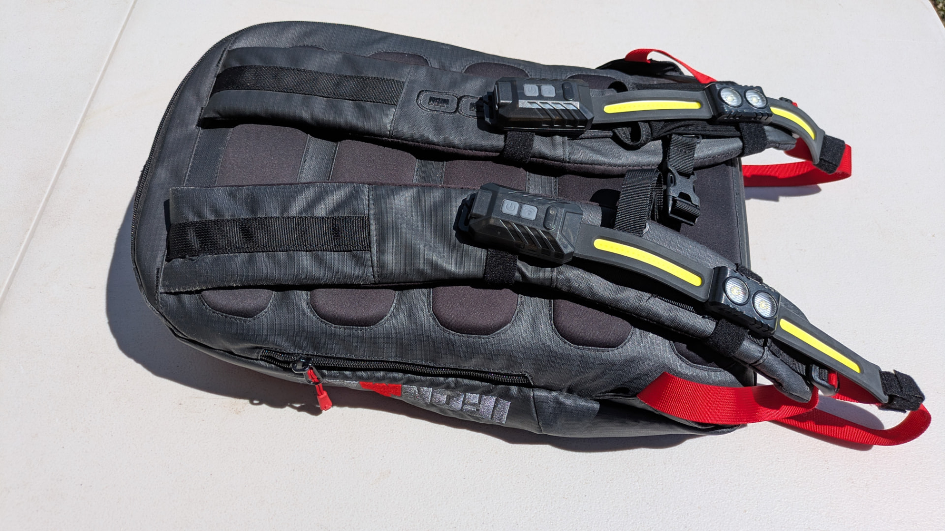 Pair of StrapLights® mounted on both shoulder straps of a backpack